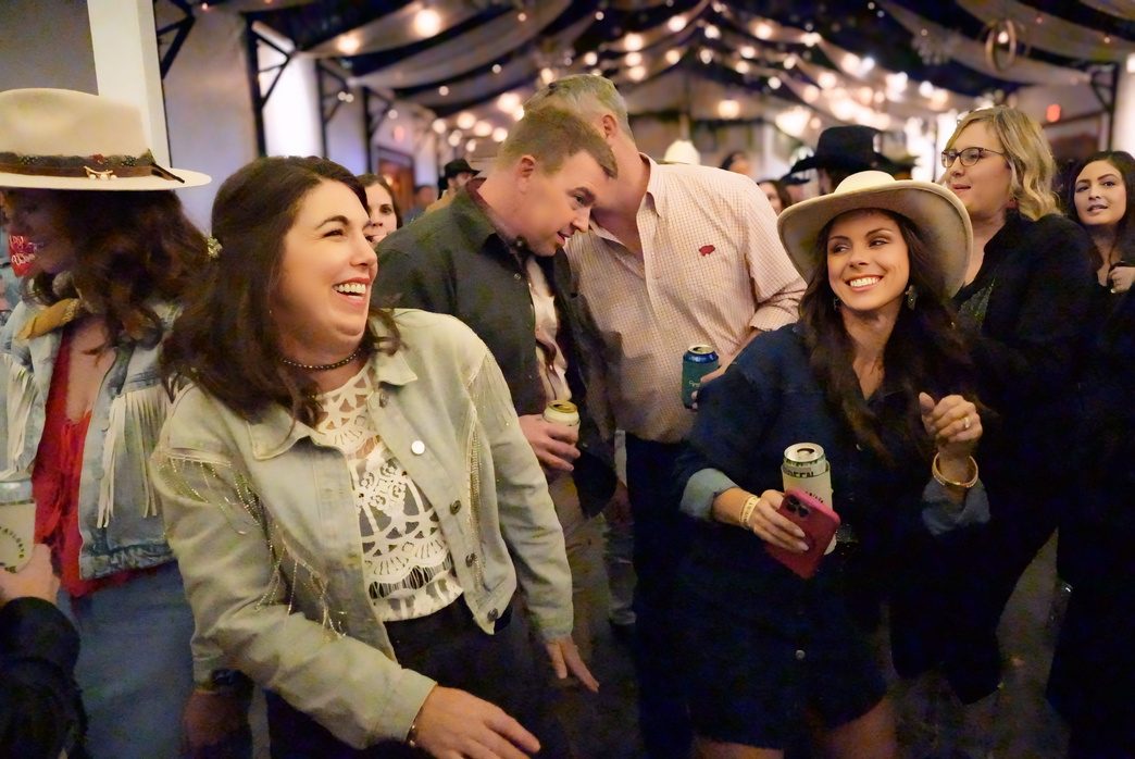 Guests socializing at the tailgate